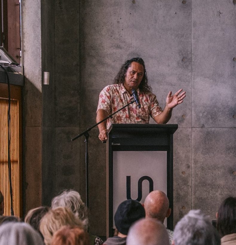 Person speaking at science symposium event.