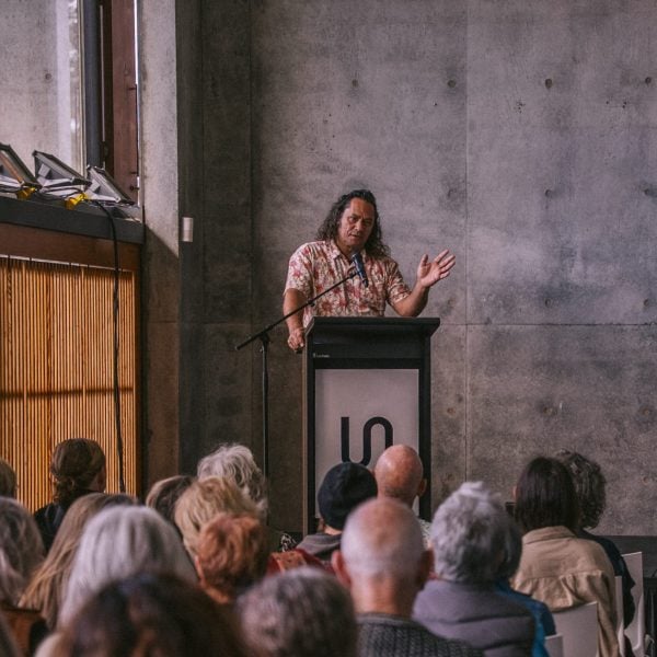 Person speaking at science symposium event.