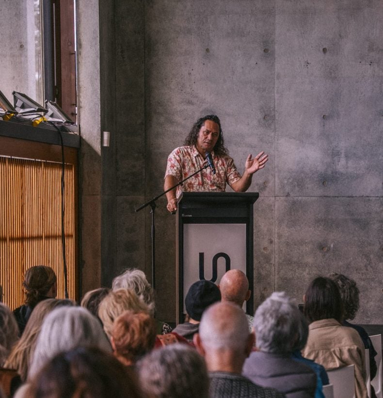 Person speaking at science symposium event.