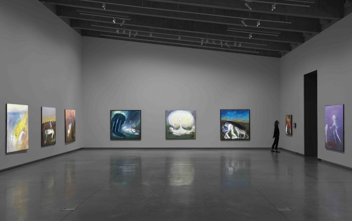 Exhibition display with person viewing work.