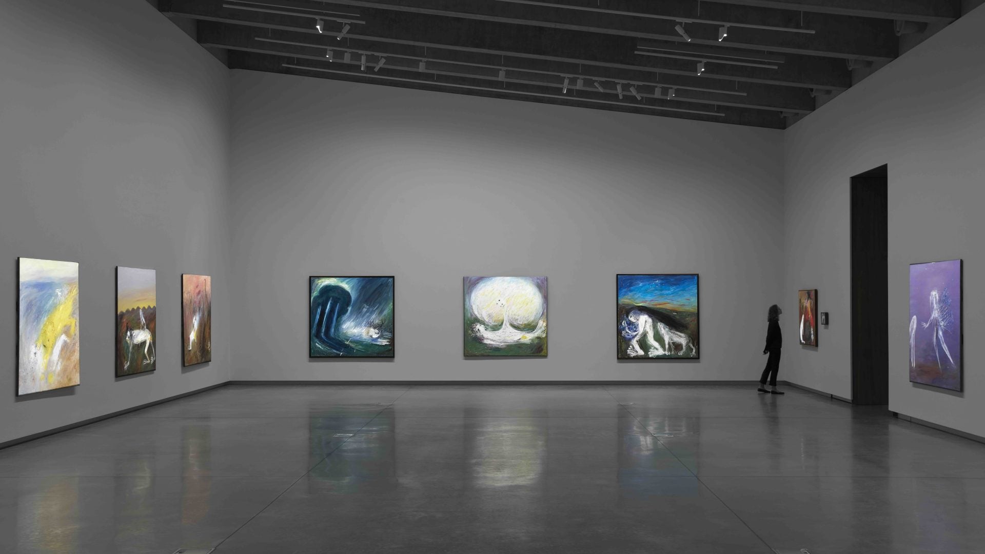Exhibition display with person viewing work.
