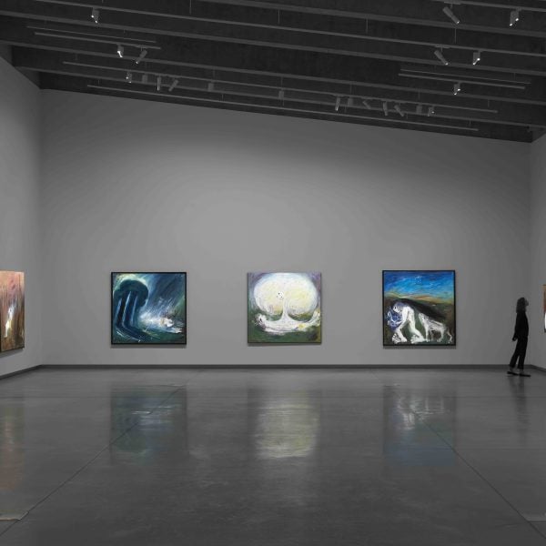 Exhibition display with person viewing work.