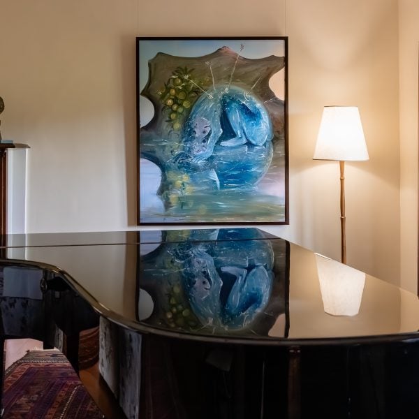 Piano in a space with artworks