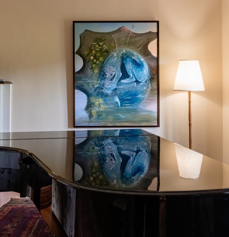 Piano in a space with artworks