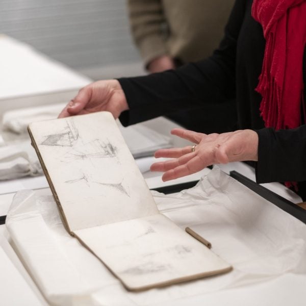 Hands showing an object of a drawing