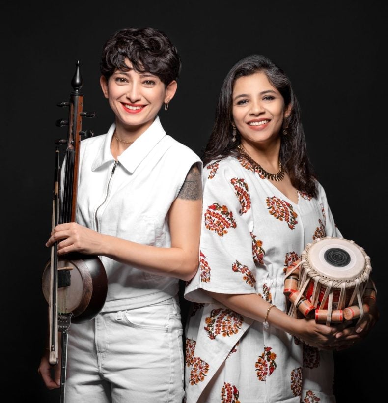 Two women with musical instruments