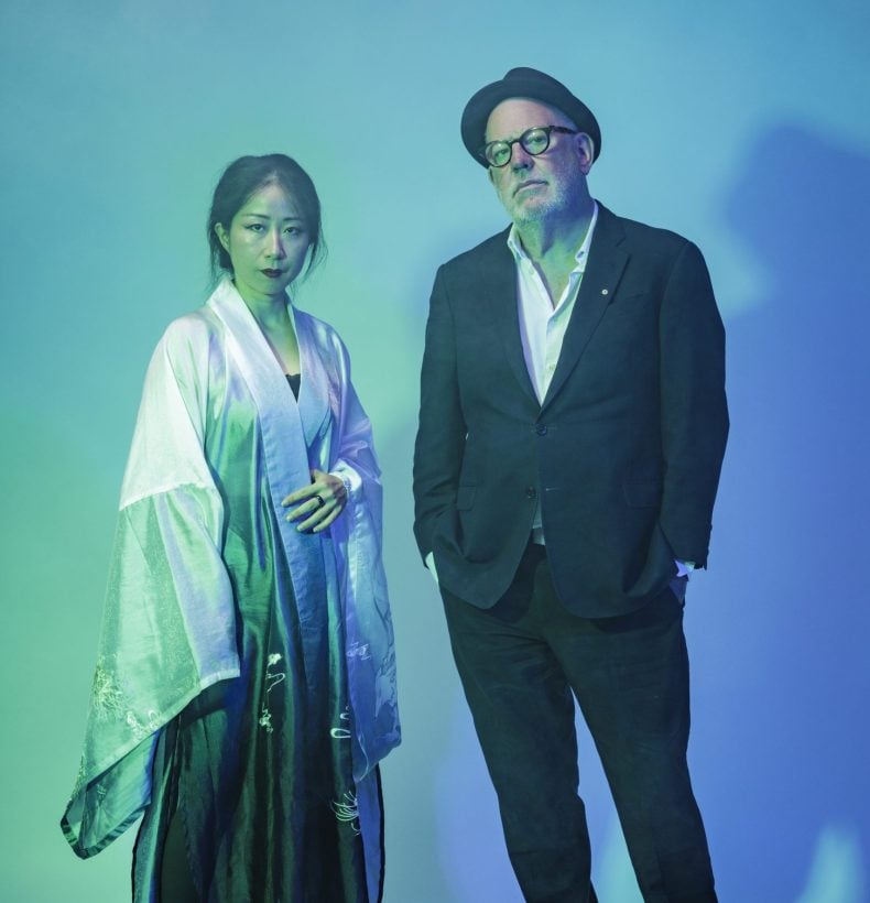 Woman and man in blue hue studio